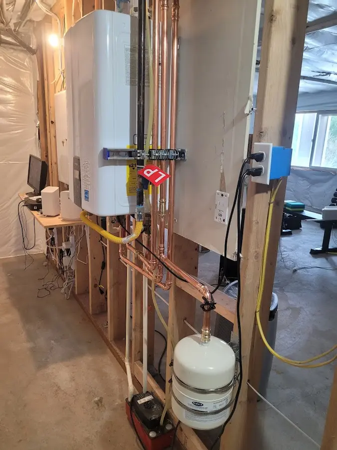 Licensed plumber repairing a kitchen sink in Burien